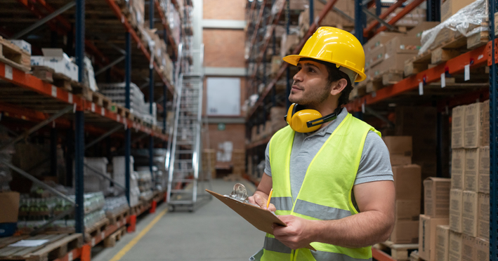 Employee conducting a physical inventory count using inventory management software